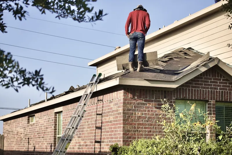 Professional roofer working on a residential roof in Delaware Meadows